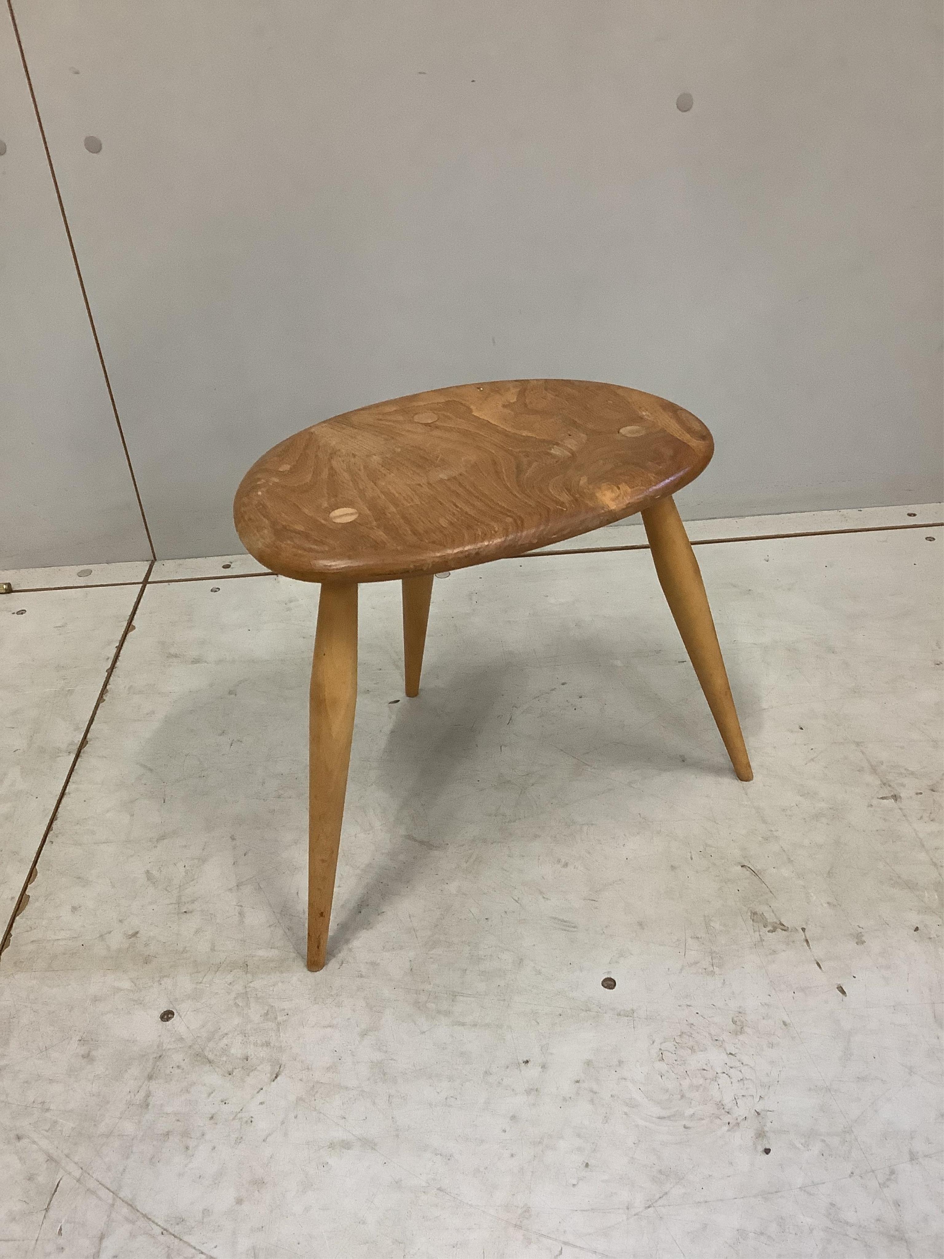 An Ercol oval elm coffee table and a nest of two tables, largest width 98cm, depth 84cm, height 44cm. Condition - poor